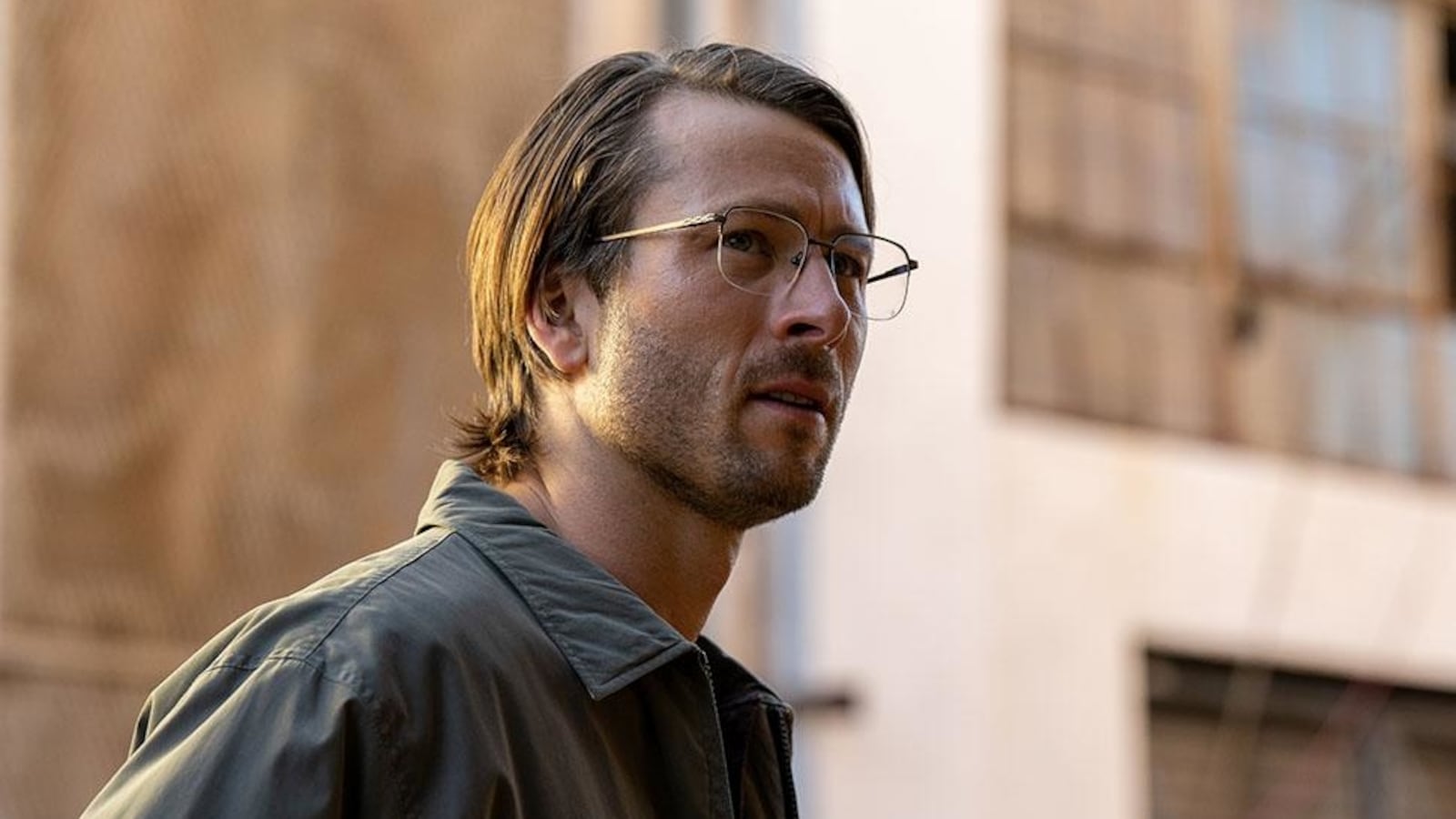 A photo still of Glen Powell in 'Hit Man'