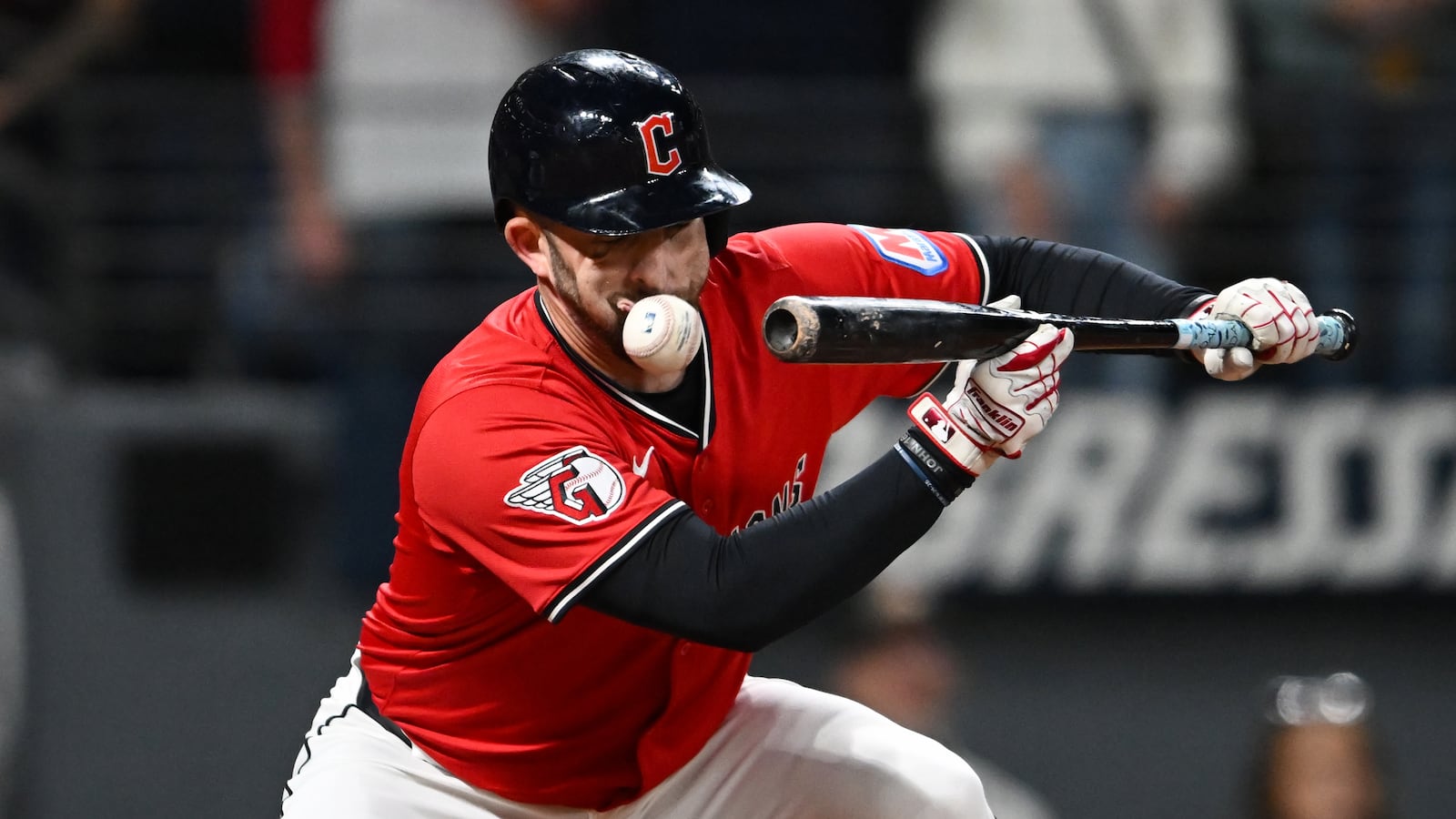 CLEVELAND, OHIO - SEPTEMBER 23: David Fry #6 of the Cleveland Guardians fouls a bunt off his face during the sixth inning against the Detroit Tigers at Progressive Field on September 23, 2025 in Cleveland, Ohio. (Photo by Nick Cammett/Getty Images)