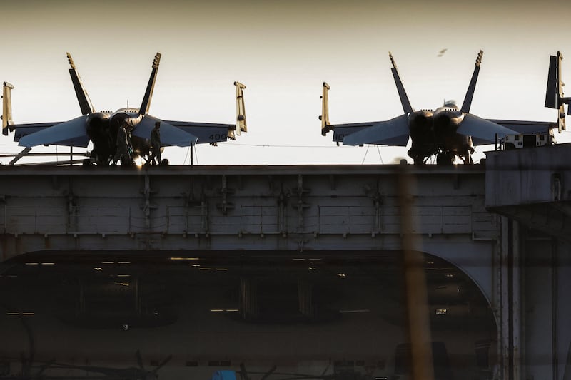 Personnel and aircraft on the deck of the U.S. Navy Nimitz-class aircraft carrier USS Abraham Lincoln as it docks at Laem Chabang Port for a rest stop following a long deployment in the Middle East, in Chonburi province, Thailand, September 3, 2026. REUTERS/Chalinee Thirasupa