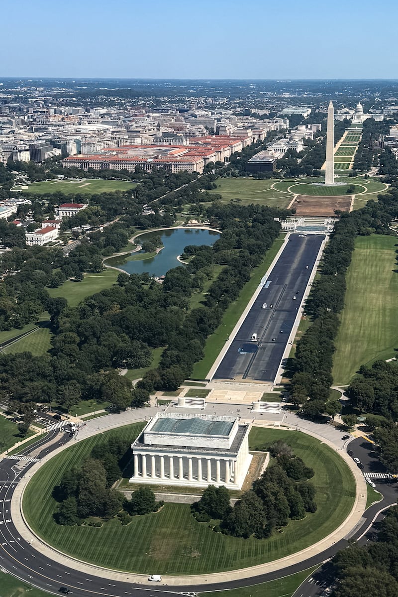 An aerial view, taken through the window of an airplane, of the National Mall, including the Washington Monument and ongoing construction at the Lincoln Memorial Reflecting Pool, in Washington, D.C., U.S., September 16, 2026. REUTERS/Kylie Cooper