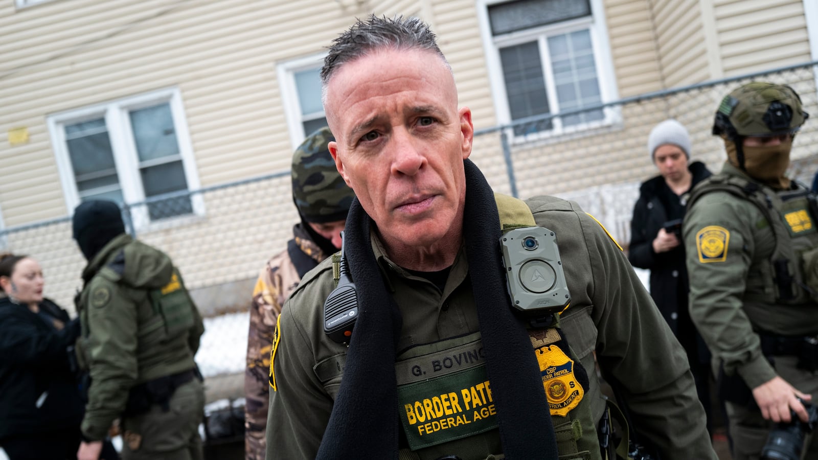Border Patrol Chief Gregory Bovino (C) looks on as federal agents arrest a man on January 08, 2026 in Minneapolis, Minnesota.
