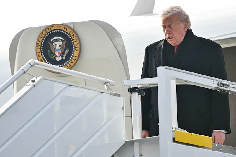 US President Donald Trump steps off Air Force One upon arrival at Zurich Airport on January 21, 2026. The World Economic Forum takes place in Davos from January 19 to January 23, 2026. (Photo by Mandel NGAN / AFP via Getty Images)