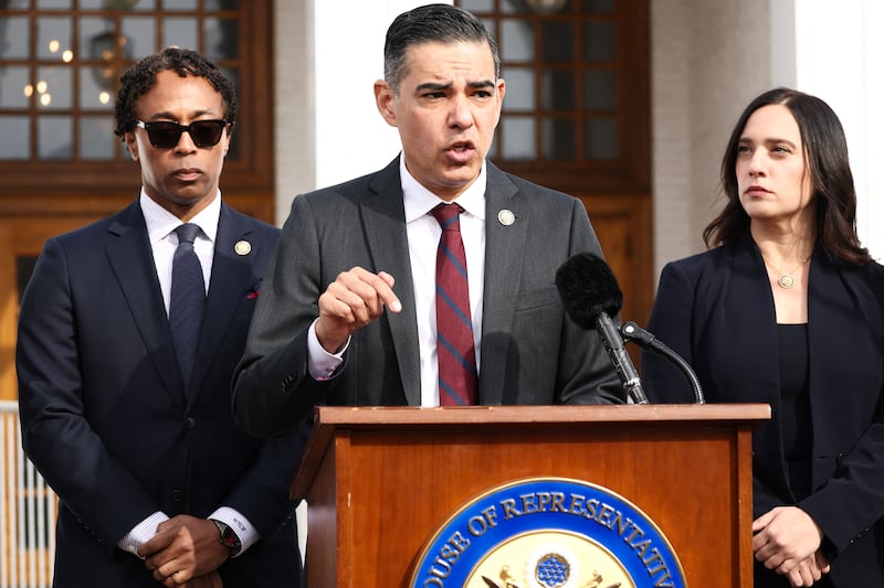 House Oversight Committee Ranking Member Robert Garcia, flanked by Rep. Wesley Bell and Rep. Yassamin Ansari, gives an update on the deposition of Hillary Clinton in the Jeffrey Epstein probe.