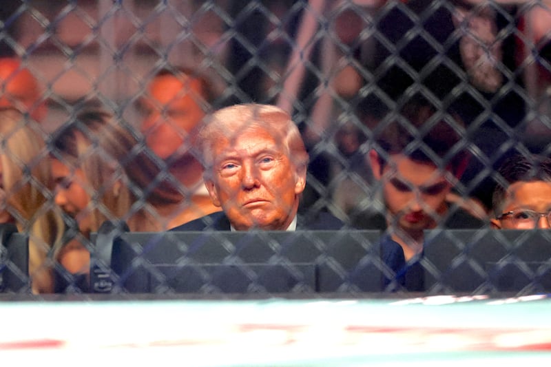U.S. President Donald Trump watches a match during the UFC 327 event at Kaseya Center in Miami, Florida, U.S., April 11, 2026.