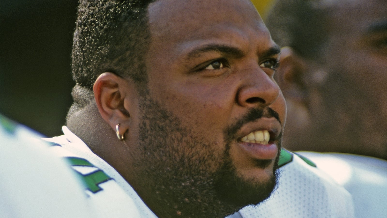 PHILADELPHIA, PA - OCTOBER 8: Defensive lineman Kevin Johnson #94 of the Philadelphia Eagles looks on from the sideline during a game against the Washington Redskins at Veterans Stadium on October 8, 1995 in Philadelphia, Pennsylvania. The Eagles defeated the Redskins 37-34.