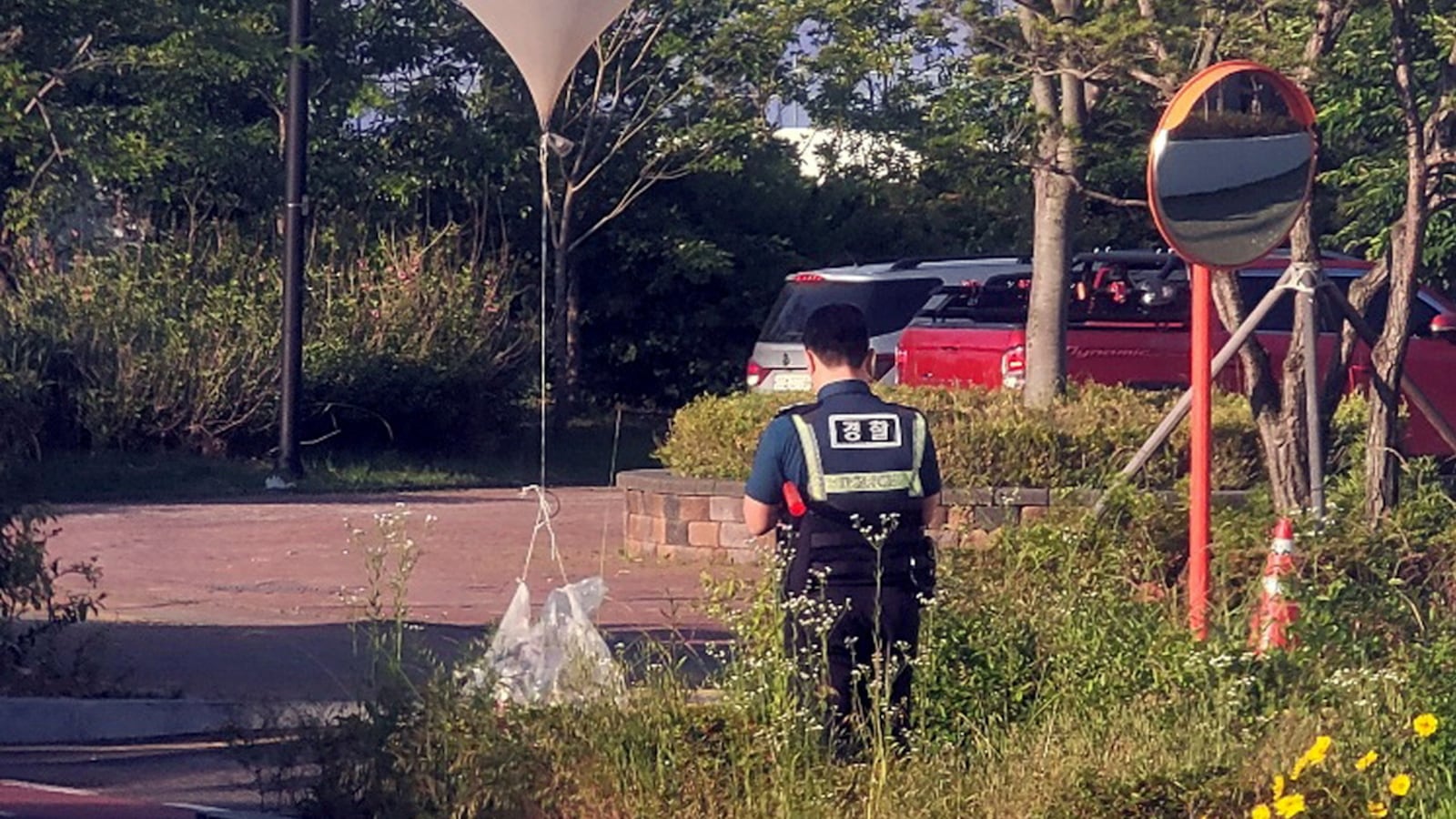 A balloon believed to have been sent by North Korea, carrying various objects including what appeared to be trash, is pictured at a park in Incheon, South Korea, June 2, 2024.