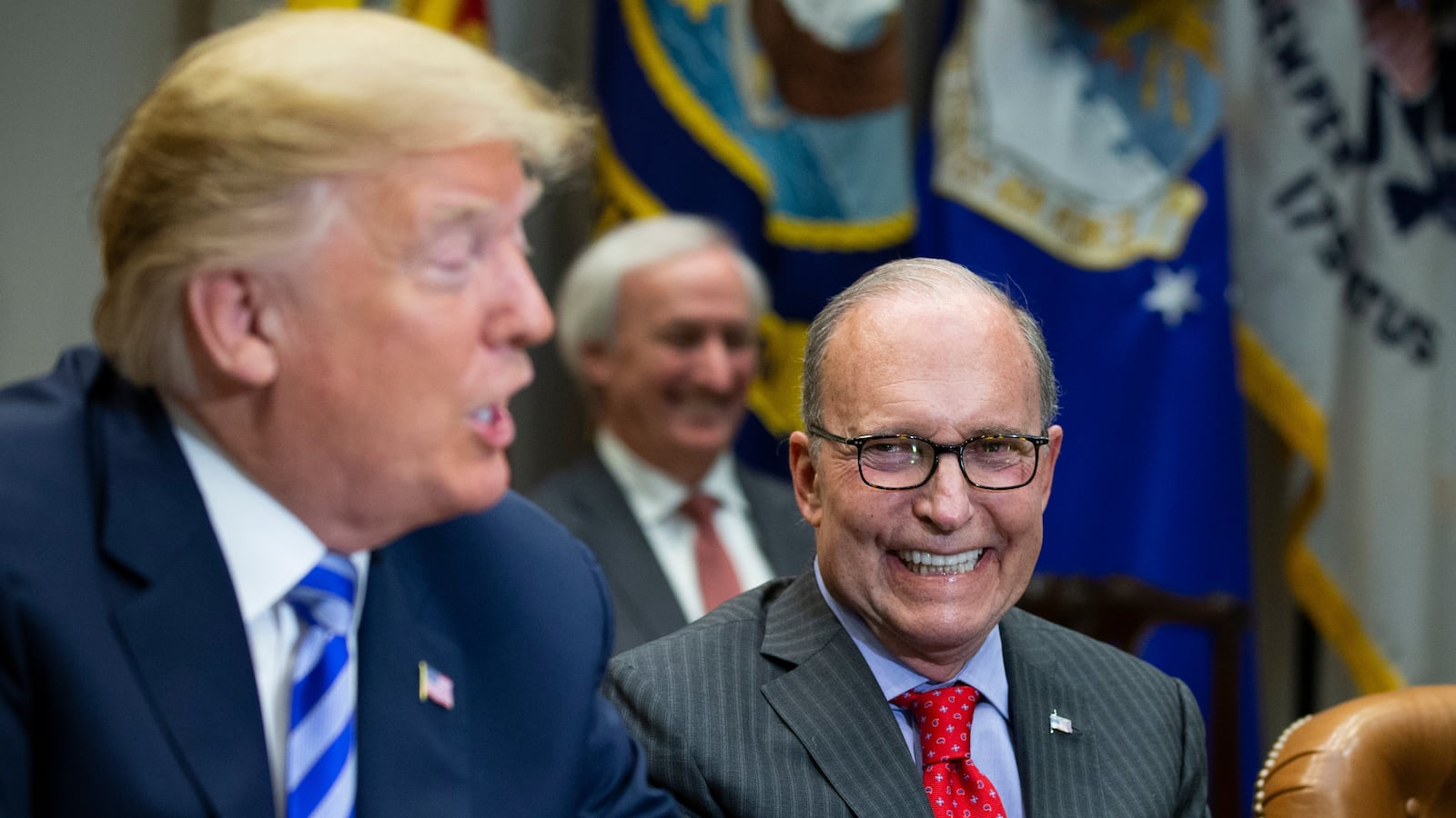 Director of National Economic Council Larry Kudlow smiles as United States President Donald J. Trump speaks with reporters during a meeting with automotive industries executives in the Roosevelt Room of the White House on May 11, 2018 in Washington, DC.