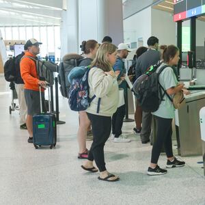 Passengers stand in line at Newark Liberty International Airport on June 2.