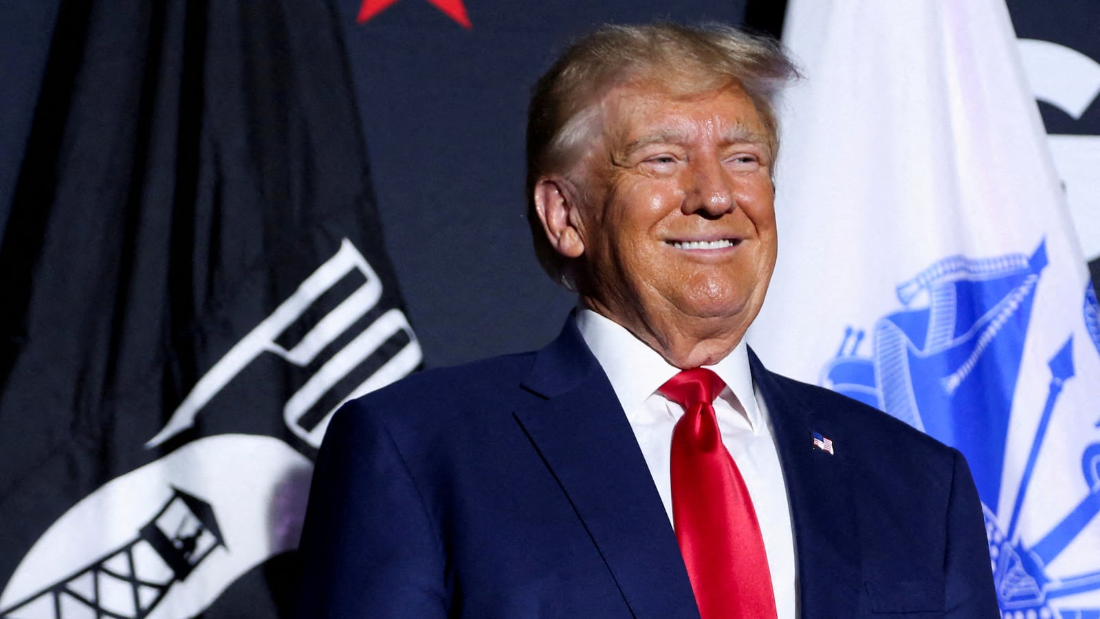 Donald Trump smiles during a campaign rally in Windham, New Hampshire, Aug. 8, 2023.