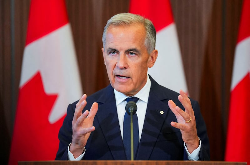 Carney speaks with the news media after he suspended trade negotiations with the United States.