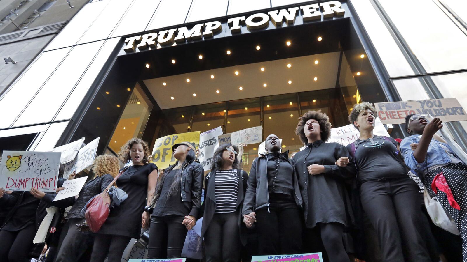 articles/2016/10/18/survivors-lead-trump-tower-protest-against-cheeto-voldemort/161017-Ryan-Trump-Tower-Protests-tease_oupuha