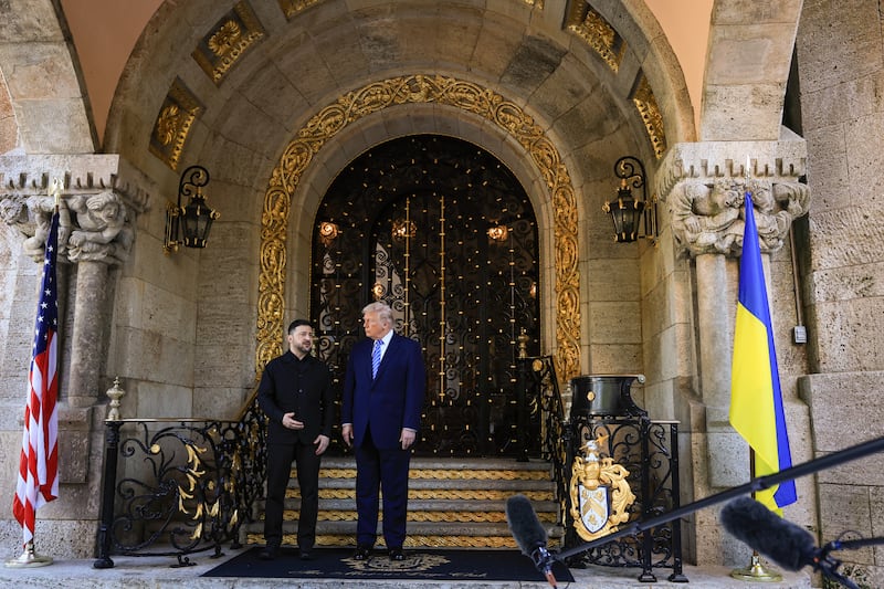 PALM BEACH, FLORIDA - DECEMBER 28: Ukrainian President Volodymyr Zelensky is greeted by U.S. President Donald Trump at Trump’s Mar-a-Lago club on December 28, 2025 in Palm Beach, Florida. Trump invited Zelensky to his private club to work on a U.S.-proposed peace plan to end the war in Ukraine as the conflict approaches four years since the sudden full-scale invasion by Russia on February 24, 2022. (Photo by Joe Raedle/Getty Images)