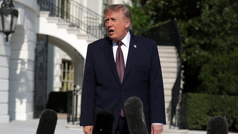U.S. President Donald Trump speaks to members of the media prior to a South Lawn departure at the White House on October 2, 2026 in Washington, DC.
