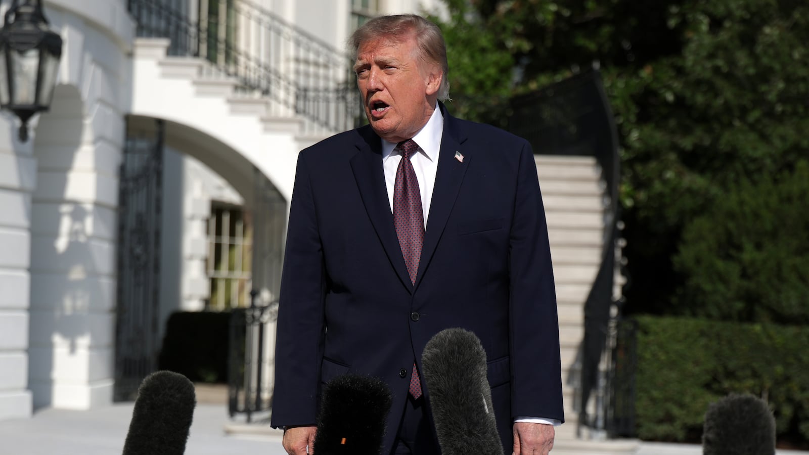 U.S. President Donald Trump speaks to members of the media prior to a South Lawn departure at the White House on October 2, 2026 in Washington, DC.