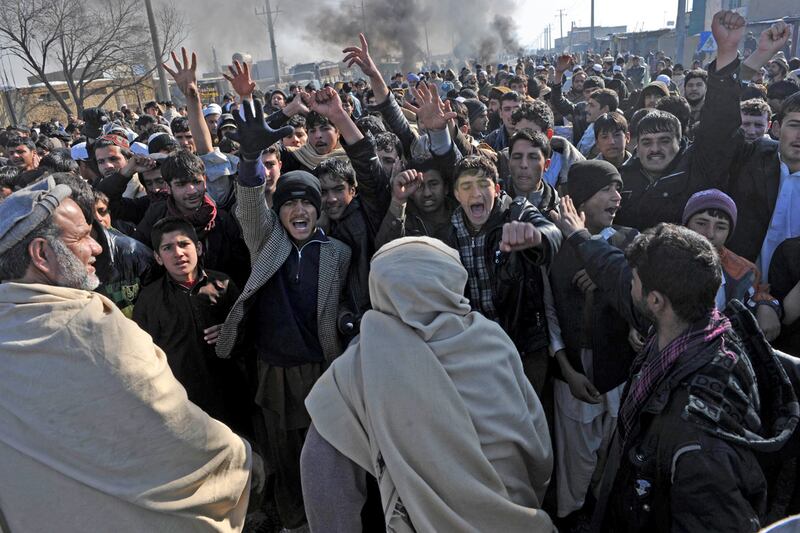 galleries/2012/02/23/quran-burning-protests-turn-deadly-in-afghanistan-photos/afghanistan-protests-continue-cheat_ciiwc2