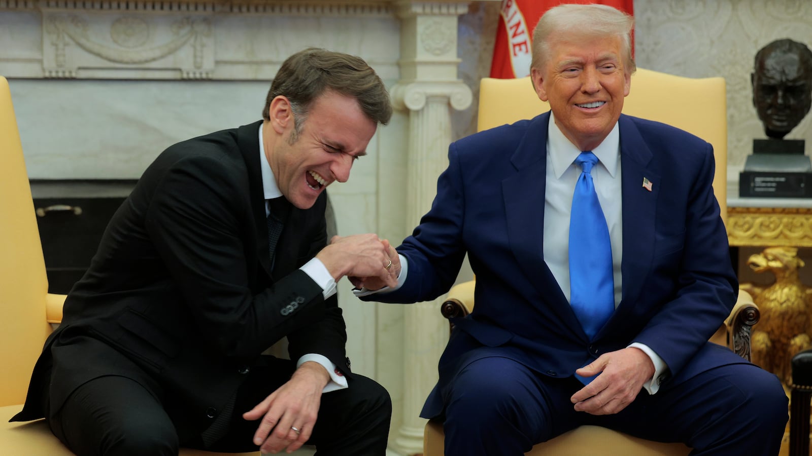 Donald Trump and Emmanuel Macron shake hands