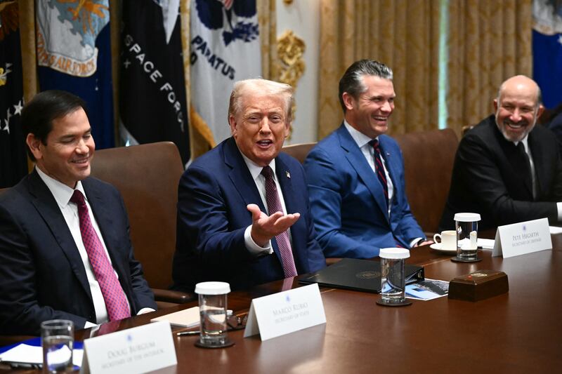 Donald Trump speaks during a cabinet meeting, alongside Secretary of State Marco Rubio (L), Secretary of Defense Pete Hegseth (2R), and Secretary of Commerce Howard Lutnick.