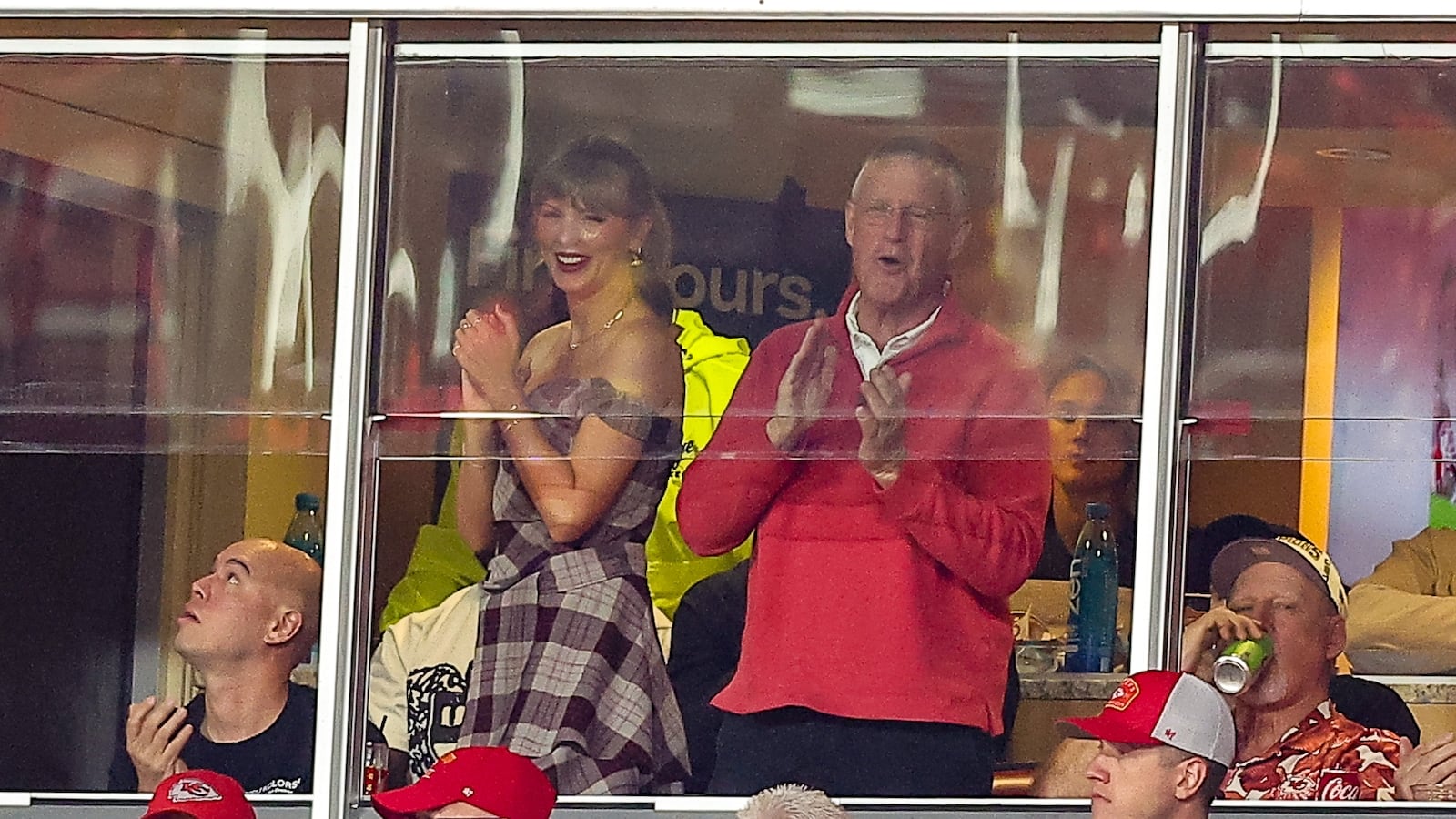 Taylor Swift and her father, Scott Swift, watch the NFL game between the Kansas City Chiefs and the New Orleans Saints at GEHA Field at Arrowhead Stadium on October 7, 2024 in Kansas City, Missouri.