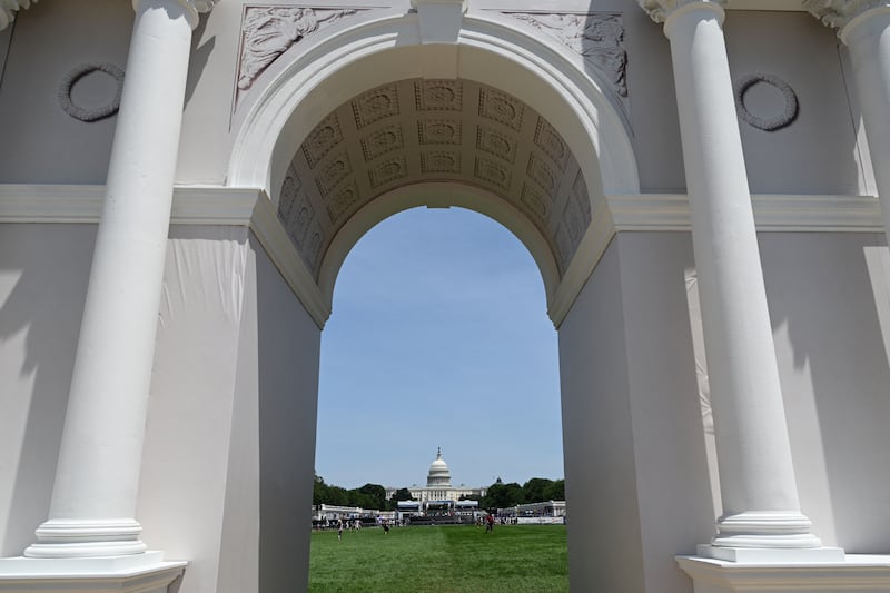 The U.S. Capitol is seen through an archway during the "Great American State Fair" on the National Mall in Washington, DC, on June 30, 2026.