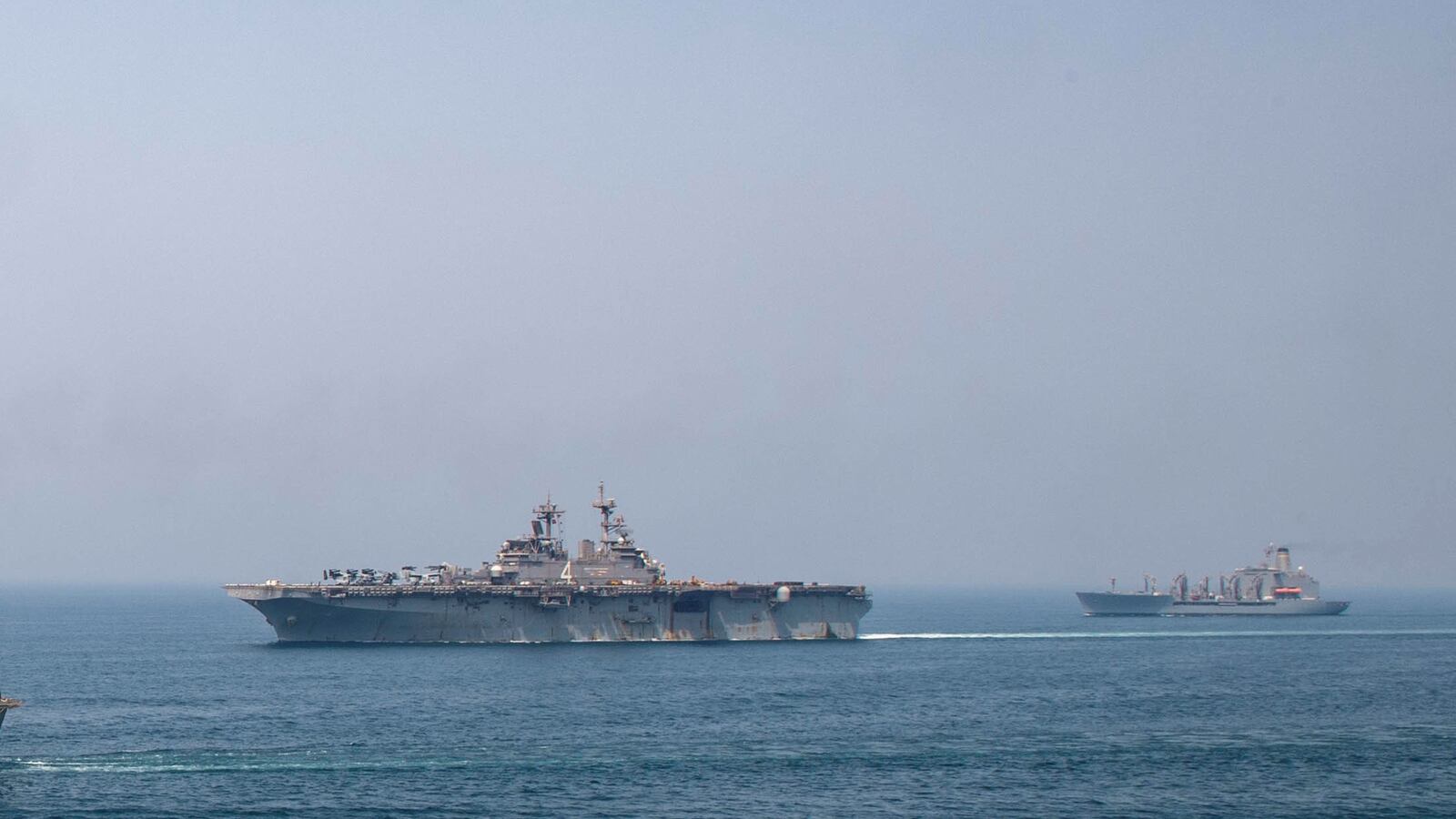 Fleet replenishment oiler USNS Big Horn (L), amphibious assault ship USS Boxer (C), and fleet replenishment oiler USNS Tippecanoe transit the Arabian Gulf.