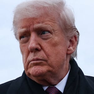White House Chief of Staff Susie Wiles walks as U.S. President Donald Trump speaks with reporters, after he disembarked Air Force One on his return from Dover, Delaware, at Joint Base Andrews, Maryland, U.S., December 17, 2025. REUTERS/Jonathan Ernst