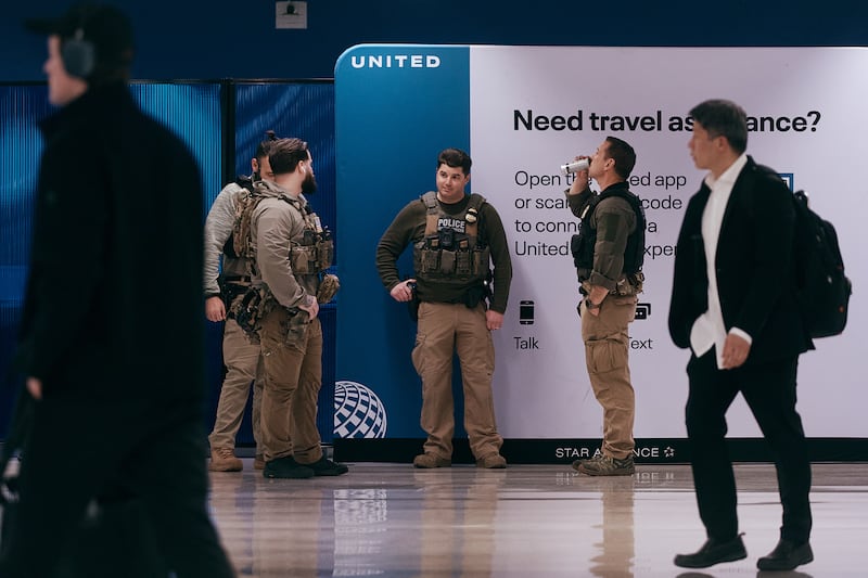 NEWARK, NEW JERSEY - MARCH 23: ICE agents patrol inside Newark Liberty International Airport on March 23, 2026 in Newark, New Jersey. The travel disruptions continue as hundreds of TSA agents quit or work without pay during a partial government shutdown. U.S. President Donald Trump deployed ICE agents to U.S. airports on Monday, with border czar Tom Homan in charge of the effort. (Photo by Andres Kudacki/Getty Images)