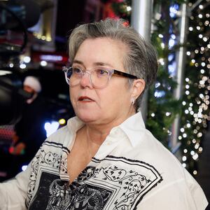 Rosie O'Donnell looking at a camera.