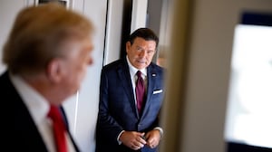 President Donald Trump (L), accompanied by FOX News journalist Bret Baier (R), speaks to members of the media aboard Air Force One on August 15, 2025, in flight. President Trump is traveling to Anchorage, Alaska, for peace talks with Russian President Vladimir Putin on the war with Ukraine.