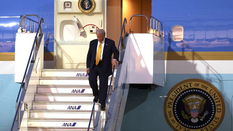 U.S. President Donald Trump disembarks Air Force One as he arrives at Haneda Airport on October 27, 2025 in Tokyo, Japan.
