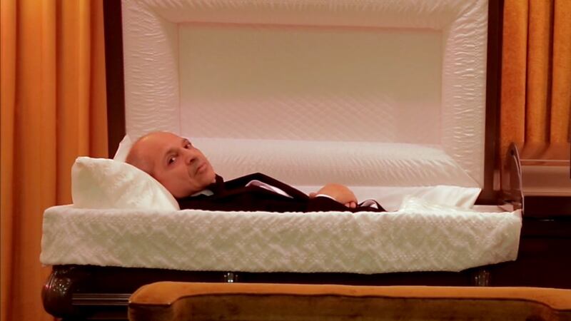 Caveh Zahedi in a casket.