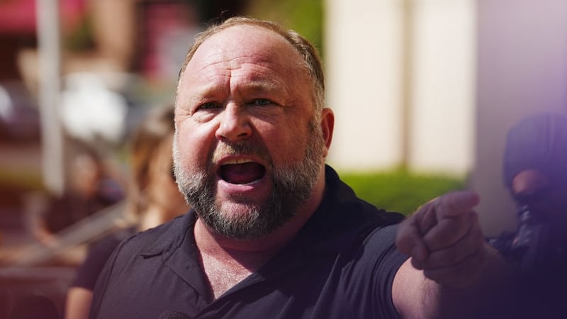 InfoWars founder Alex Jones speaks to the media outside Waterbury Superior Court during his trial on September 21, 2022 in Waterbury, Connecticut. Jones is being sued by several victims' families for causing emotional and psychological harm after they lost their children in the Sandy Hook massacre. A Texas jury last month ordered Jones to pay $49.3 million to the parents of 6-year-old Jesse Lewis, one of 26 students and teachers killed in the shooting in Newtown, Connecticut. (Photo by Joe Buglewicz/Getty Images)