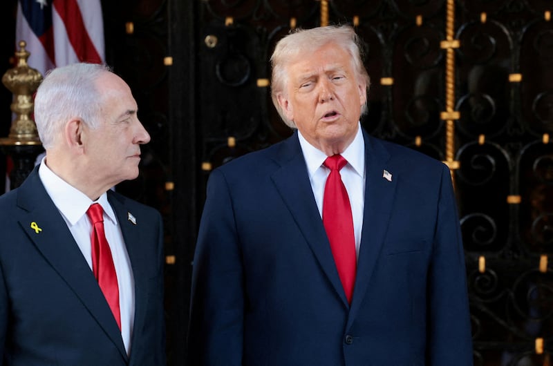 U.S. President Donald Trump speaks next to Israeli Prime Minister Benjamin Netanyahu upon arrival for meetings at Trump's Mar-a-Lago club in Palm Beach, Florida, U.S., December 29, 2025. REUTERS/Jonathan Ernst