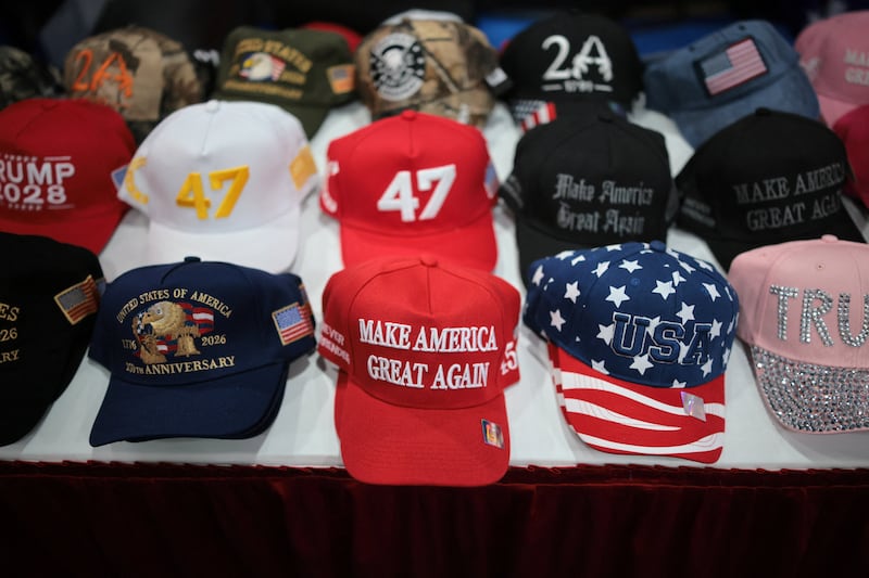 Hats referencing U.S. President Donald Trump lie on a table during the Conservative Political Action Conference (CPAC) USA 2026 at the Gaylord Texan Resort and Convention Center, in Grapevine, Texas, U.S. March 25, 2026.  REUTERS/Daniel Cole