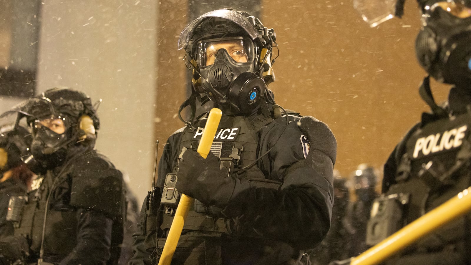 Protesters clash with law enforcement while holding a 'noise demonstration' outside of a hotel believed to be housing federal immigration agents near Minneapolis, United States, on January 26, 2025.