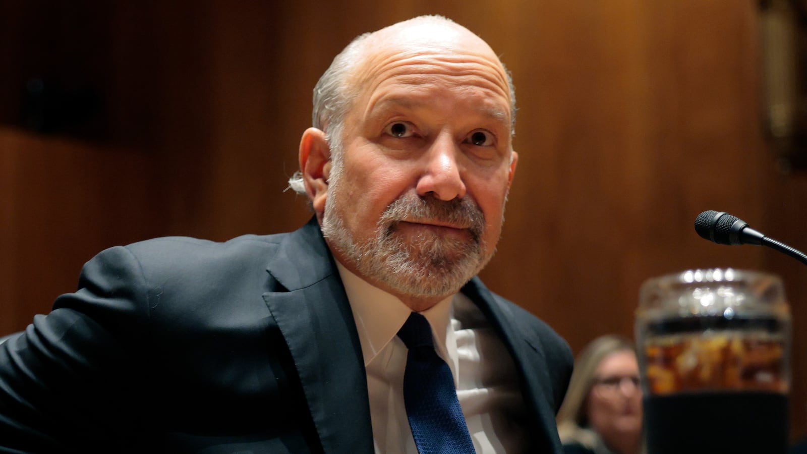 Commerce Secretary Howard Lutnick arrives to testify during a Senate subcommittee as he faces bipartisan calls to resign after new revelations came to light in the latest release of Epstein files.