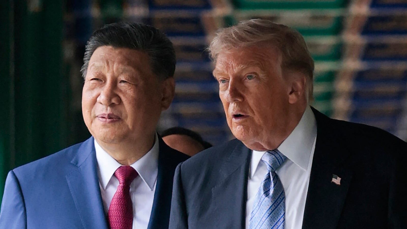 US President Donald Trump (R) walks with China's President Xi Jinping (L) at Zhongnanhai Garden in Beijing on May 15, 2026. (Photo by Evan Vucci / POOL / AFP via Getty Images)