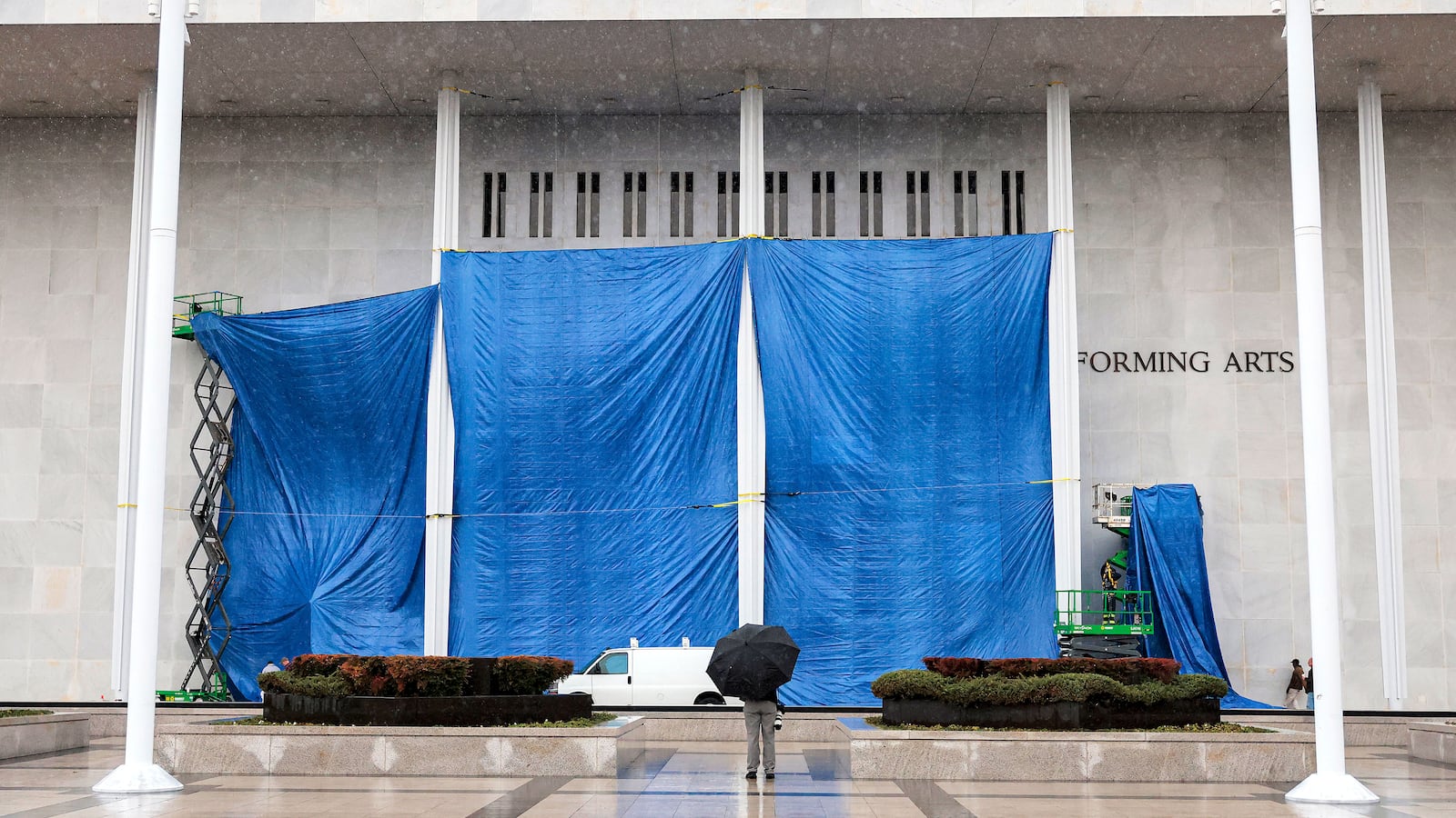 Workers begin adjusting the name of the “John F. Kennedy Memorial Center for the Performing Arts" on December 19, 2025 in Washington, DC. The Kennedy Center Board of Trustees voted in what they say was a unanimous decision to rename the facility “The Donald J. Trump and The John F. Kennedy Memorial Center for the Performing Arts”.