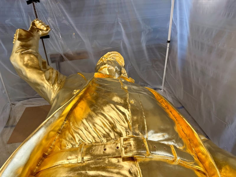 A 15-foot-tall gold-leafed bronze statue of U.S. President Donald Trump, designed by sculptor Alan Cottrill, at his studio in Zanesville, Ohio, U.S., February 10, 2026. REUTERS/Eric Cox