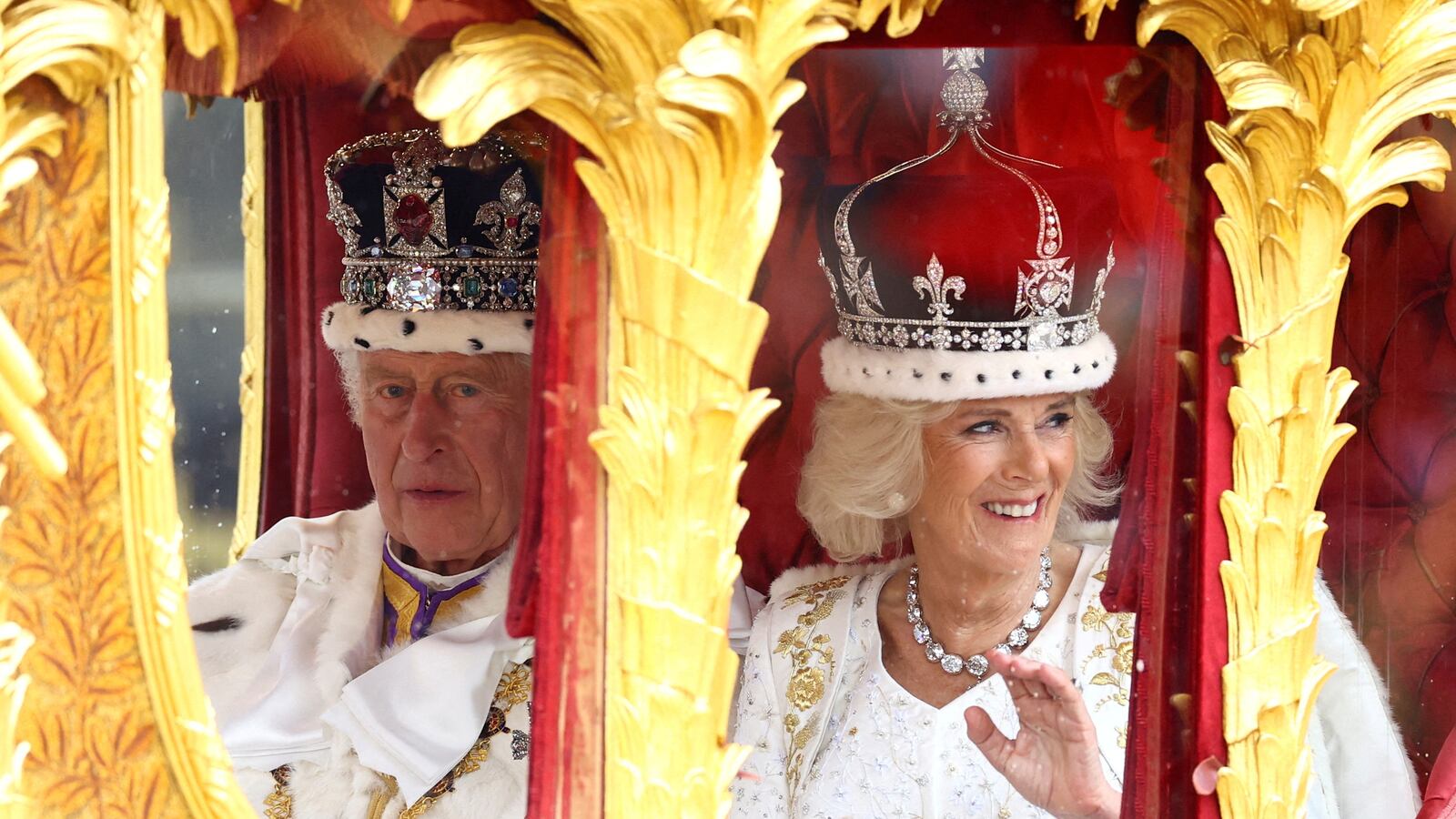 Britain’s King Charles and Queen Camilla travel from Westminster Abbey in the Gold State Coach, following their coronation ceremony, in London, Britain, May 6, 2023.