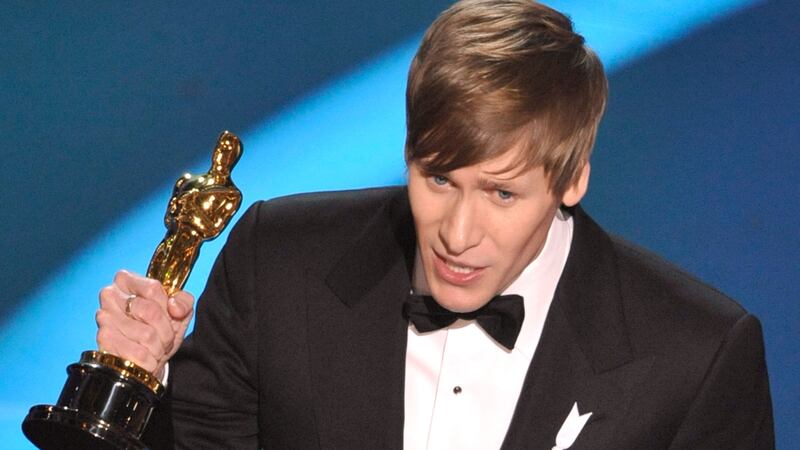 LOS ANGELES, CA - FEBRUARY 22:  (EDITORS NOTE: NO ONLINE, NO INTERNET, EMBARGOED FROM INTERNET AND TELEVISION USAGE UNTIL THE CONCLUSION OF THE LIVE OSCARS TELECAST)  Screenwriter Dustin Lance Black receives his Best Original Screenplay award for "Milk" during the 81st Annual Academy Awards held at Kodak Theatre on February 22, 2009 in Los Angeles, California.  (Photo by Kevin Winter/Getty Images)