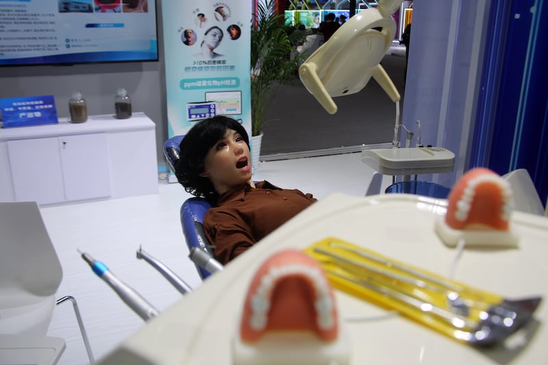BEIJING, CHINA - MAY 8, 2025 - A medical robot demonstrated the dental surgery process at the 27th China Beijing International High-tech Expo (CHITEC) in Beijing, China on May 8, 2025.