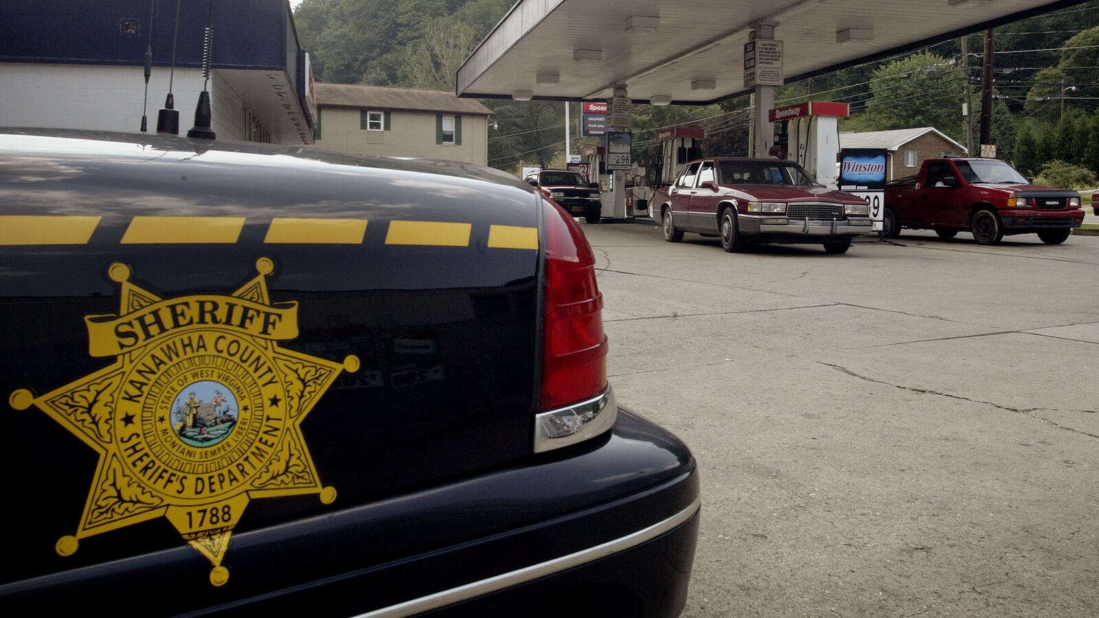A Kanawha County Sheriff's car sits outside the gas station.