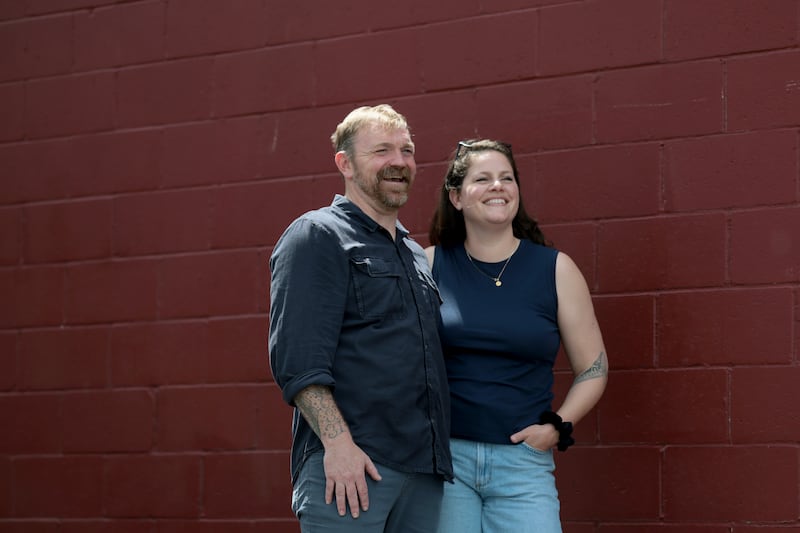 PORTLAND, MAINE - MAY 17:  U.S. Senate candidate from Maine Graham Platner and his wife Amy Gertner share a moment after an event at the Veterans of Foreign Wars Post 6859 on May 17, 2026, in Portland, Maine. During the event, he received an endorsement from the Veterans for Responsible Leadership and hosted a town hall to answer questions and discuss ending the war in Iran. (Photo by Joe Raedle/Getty Images)