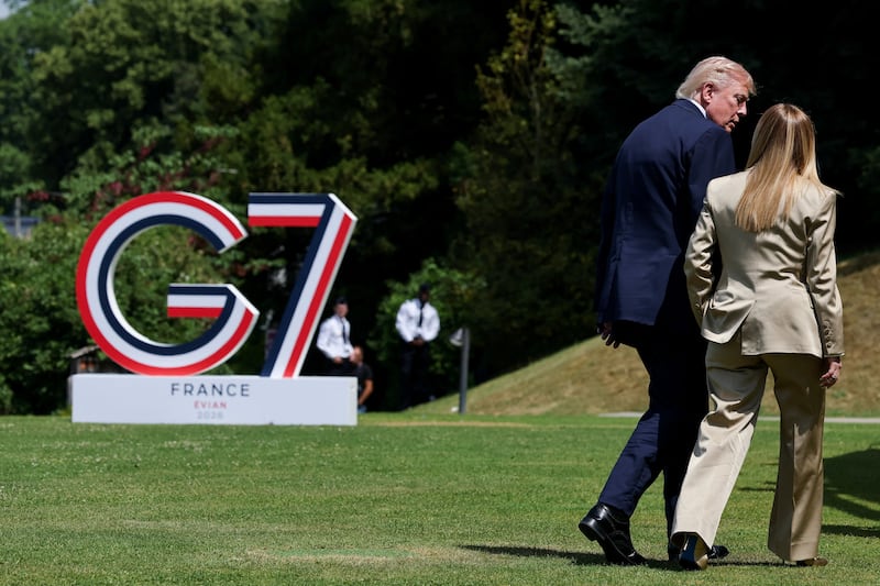 U.S. President Donald Trump walks with Italian Prime Minister Giorgia Meloni during the G7 summit, in Evian-les-Bains, France, June 16, 2026. REUTERS/Christian Hartmann