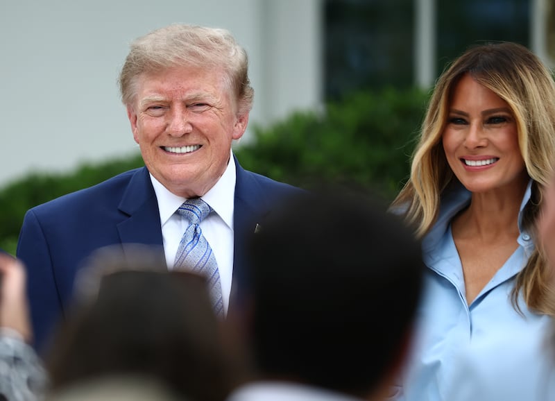 President Donald Trump poses with first lady Melania Trump during an event announcing the expansion of a foster care initiative in the Rose Garden of the White House on August 20, 2026 in Washington, DC.