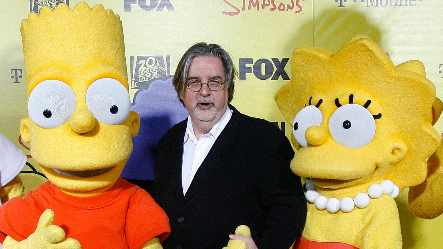 Matt Groening with Bart and Lisa Simpson