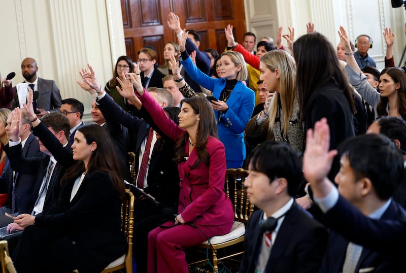 Journalist and CNN news anchor Kaitlan Collins and other journalist raise their hands during a joint press conference between U.S. President Donald Trump and Japanese Prime Minister Shigeru Ishiba in the East Room at the White House on February 07, 2025 in Washington, DC.