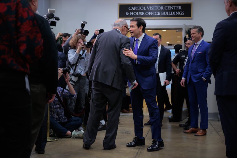 WASHINGTON, DC - JANUARY 07: Senate Minority Leader Charles Schumer (D-NY) (L) talks with U.S. Secretary of State Marco Rubio before he and Secretary of War Pete Hegseth speak to reporters in between closed door briefings about the U.S. capture of Venezuela’s Nicolas Maduro and his wife, Cilia Flores, at the U.S. Capitol on January 7, 2026 in Washington, DC. Maduro and Flores were taken to New York on Saturday after they were captured by the U.S. military in Caracas. They are being detained at the Metropolitan Detention Center in Brooklyn and are expected to face federal charges related to drug trafficking and working with gangs designated as terrorist organizations.  (Photo by Chip Somodevilla/Getty Images)