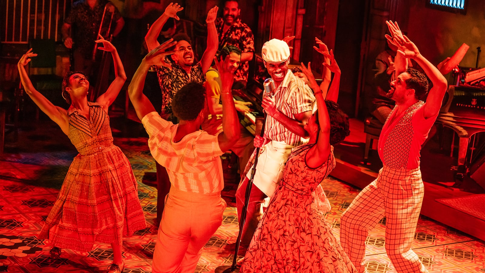 Wesley Wray (center at microphone) and the company of Buena Vista Social Club.