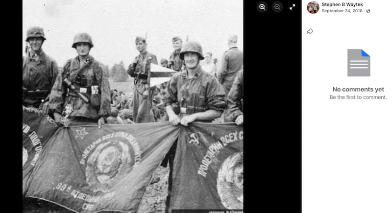A photo of SS soldiers holding captured Soviet flags in 1941 was once posted on Woytek's Facebook.